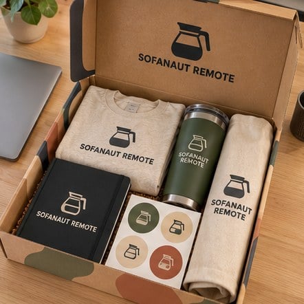 Custom company swag mailer box opened on a home office desk